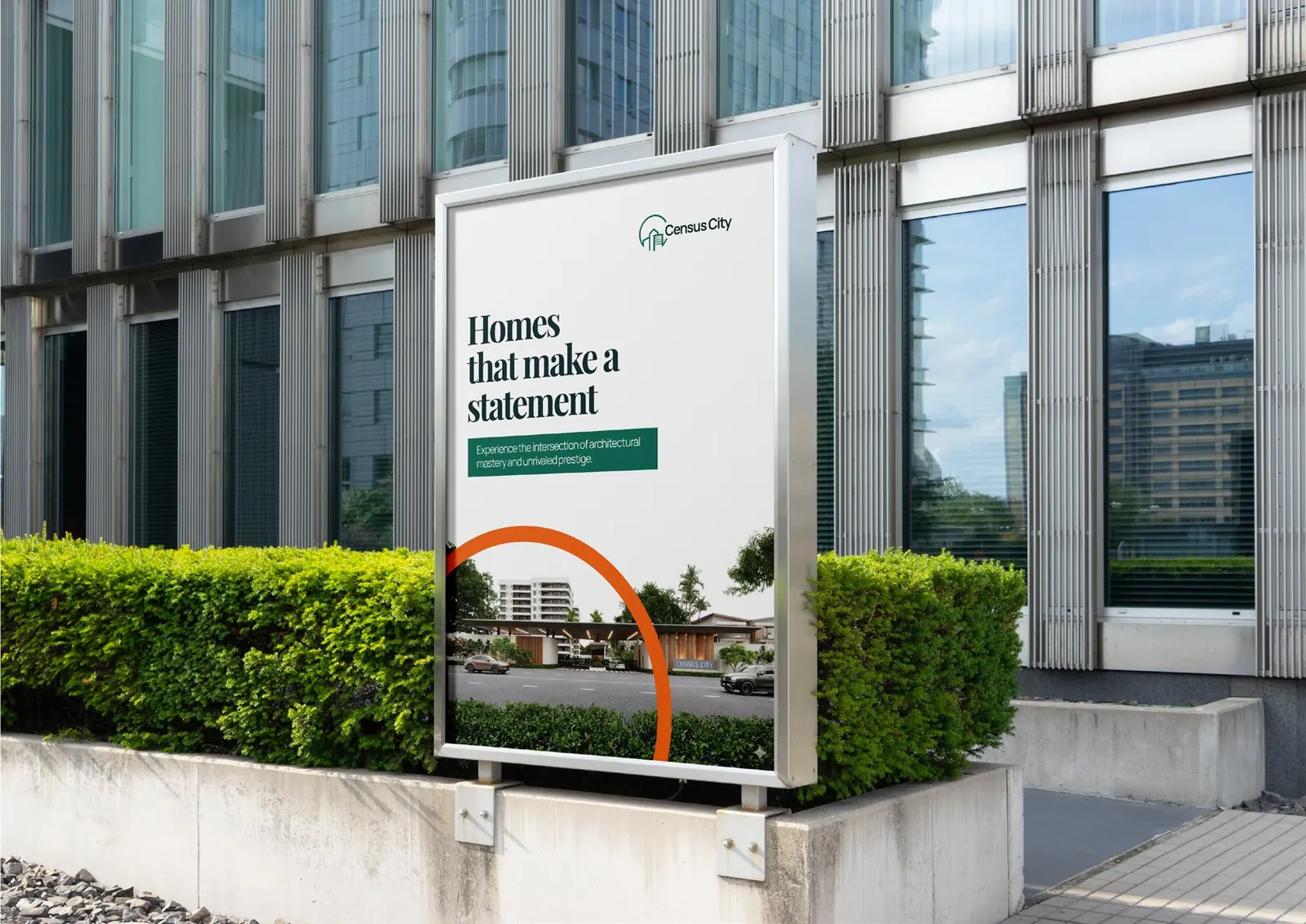 A Census City site board reading Homes that make a statement, beside a modern building.