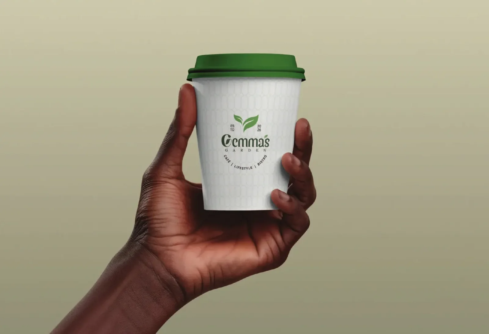 A branded paper cup held in hand.